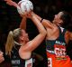 Collingwood's Caitlin Thwaites takes a shot against the Giants.