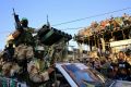 Palestinian members of the Izzedine al-Qassam Brigades, the armed wing of Hamas,  during a rally in the Rafah refugee ...