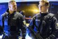 DUSSELDORF, GERMANY - MARCH 09: Police and emergency workers stand outside the main railway station following what ...