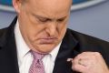 White House press secretary Sean Spicer adjusts his American flag pin after he was told that it was upside down.