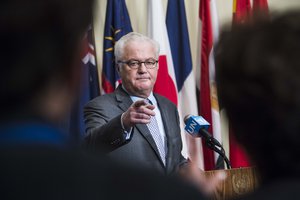 Vitaly Churkin, Permanent Representative of the Russian Federation to the United Nations and President of the Security Council for October, briefs the press at the Security Council stakeout following consultations on Syria and Iraq