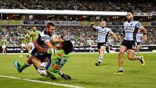 CANBERRA, AUSTRALIA - MARCH 11:  Wade Graham of the Sharks scores a try during the round two NRL match between the ...