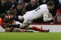 CARDIFF, WALES - FEBRUARY 11: Elliot Daly of England dives past Alex Cuthbert of Wales to score the match winning try ...