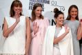 Kacey Devlin (centre) with models wearing her designs after she was named the winner of the National Designer Award at ...