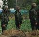 Troops stand in front of an unfinished medical centre at the Wat Dhammakaya temple compound in Pathum Thani province, ...