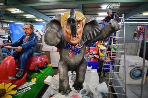 MAINZ, GERMANY - FEBRUARY 21: MCV worker Andre Menager works on a carnival float featuring an effigy of U.S. President ...