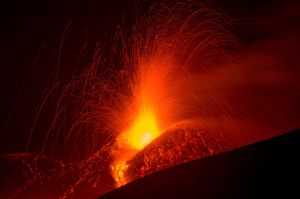 Mount Etna, Europe's most active volcano, spews lava during an eruption, near the Sicilian town of Catania, southern Italy. 