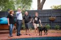 Planning Minister Richard Wynne (middle) with the McMahon family - Claire, Steve and son Joseph - in Mentone.