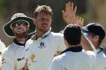 Victorian bowler James Pattinson celebrates with his teammates after taking the wicket of Jason Behrendorff.