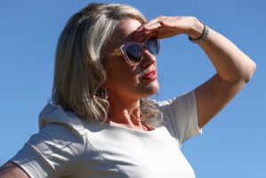 Looking smart: Chloe Shorten listens as her husband, Opposition Leader Bill Shorten, addresses the media in Logan, ...