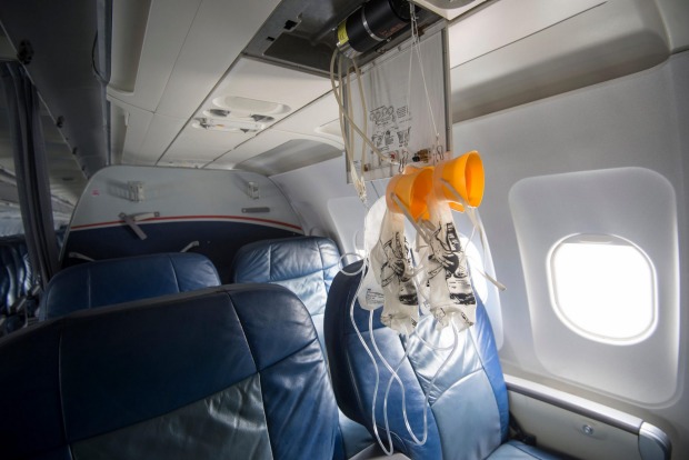 Drop-down oxygen masks are activated should cabin pressure drop.