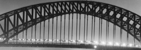 Sydney At Night Series. A view of the Sydney Harbour Bridge from the January 1955 Sydney At Night Series. SUN HERALD ...