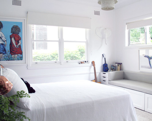 This is an example of a contemporary gender-neutral kids' room in Sydney with white walls.