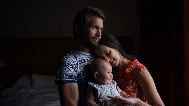 Johnny McElwee (left) and Bethan McElwee (right) hold their daughter Avaiana aged 6 months. Avaiana has SMA Type One, a ...