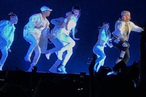 Justin Bieber flanked by 20 backup dancers.