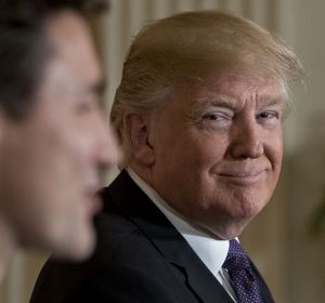 U.S. President Donald Trump smiles as Justin Trudeau, Canada's prime minister, left, speaks during a news conference in ...