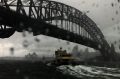 Heavy rain showers Sydney, but the prospects for Mardi Gras look a little brighter.