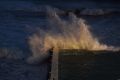 Waves hit the Bondi Icebergs pool at dawn on Monday.