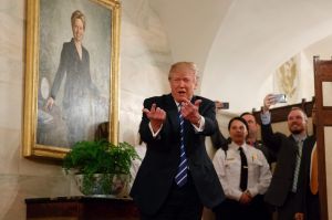 President Donald Trump greets visitors touring the White House in Washington, Tuesday, March 7, 2017. The president ...