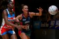 The Swifts' Samantha Wallace and Vixen Emily Mannix compete for the ball in their round three Super Netball match.