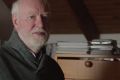 David Stratton in his home office in a scene from the film. As a young man he rebelled against his upbringing, refusing ...