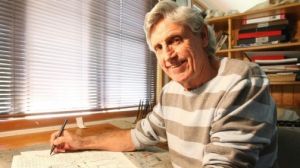 Cartoonist Murray Ball at his desk at his Gisborne home.