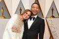 Chrissy Teigen, left, and John Legend arrive at the Oscars on Sunday, February 26, 2017, at the Dolby Theatre in Los ...