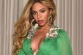 Beyonce and Blue Ivy coordinate in $60k green Gucci gowns for premiere.
