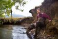 Wetlands ecologist Joe Greet in a waterway near Woori Yallock, where the banks have eroded due to a lack of vegetation.