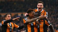 HULL, ENGLAND - MARCH 11: Oumar Niasse of Hull City (R) celebrates scoring his sides first goal with his Hull City team ...