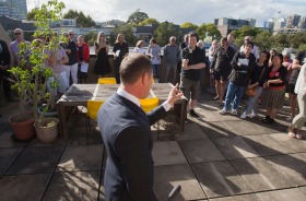 Auctioneer Gavin Croft  works the crowd at 33/52 Shepherd Street, Chippendale in Sydney on Saturday.