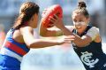 Carlton's Gabriella Pound slips a tackle on Saturday.