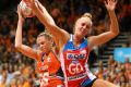 Super start: Jo Harten of the Giants and Maddy Turner of the Swifts contest possession.