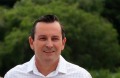 WA's next premier, Mark McGowan, on Rockingham Beach, near Perth, on Sunday with wife Sarah and children Samuel, 13, ...