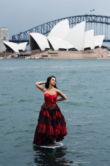 Italian Mezzo Soprano, Jose Maria Lo Monaco (who will perform the role of Carmen) standing in Farm Cove, in front of the ...