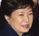 Park Geun-hye, center, arrives at her private home in Seoul.