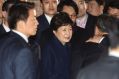 Park Geun-hye, center, arrives at her private home in Seoul.