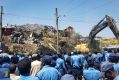 Police officers secure the perimeter at the scene of a rubbish landslide on the outskirts of Addis Ababa.