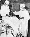 Neurosurgeons performing a prefrontal lobotomy (prefrontal leukotomy) on a patient at Eastern State Hospital in Vinita, Oklahoma, U.S., August 17, 1951.