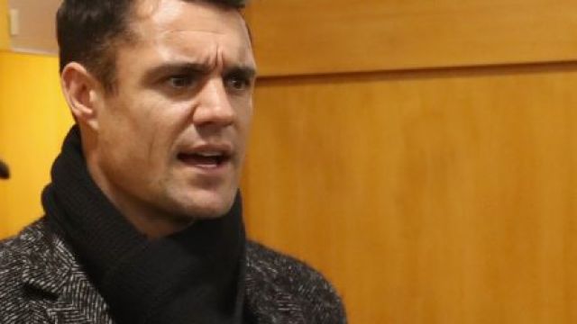 Dan Carter (R) and Conrad Smith (L) chat with Wayne Smith in the dressing room following the Test between France and New ...