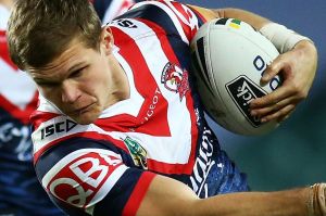 SYDNEY, AUSTRALIA - JULY 28: Dale Copley of the Roosters is tackled during the round 21 NRL match between the Sydney ...