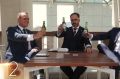 Liberal MPs Tim Wilson and Andrew Hastie brandish Coopers beer bottles in the 'Keep it Light' video.