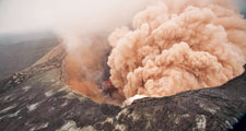 A cloud of ash issues from the Pu’u O’o crater on Hawaii’s Kilauea volcano on March 6, 2011, as lava escapes through new fissures on the volcano.