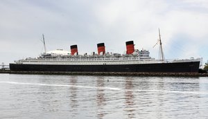 This May 15, 2015 photo shows the retired Cunard ocean liner Queen Mary, at its permanent mooring in the harbor at Long Beach, Calif. A survey has found the ship is so corroded that it's at urgent risk of flooding, and the price tag for fixing up the 1930s ocean liner could near $300 million. Documents obtained the Long Beach Press-Telegram show it would take five years to rehab the ship. Engineers who compiled the survey warn that the vessel is probably