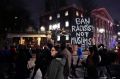 Several hundred people march through Harvard University while protesting the travel ban. 