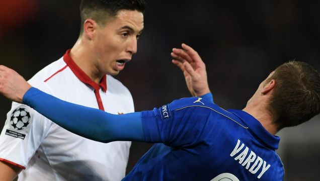 Shocked: Samir Nasri of Sevilla and Jamie Vardy of Leicester City clash.