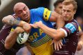 SYDNEY, AUSTRALIA - MARCH 05: Timothy Mannah of the Eels is tackled during the round one NRL match between the Manly Sea ...