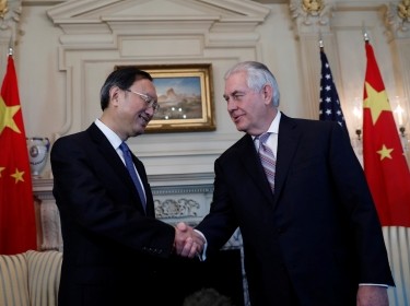 U.S. Secretary of State Rex Tillerson (right) greets Chinese State Councilor Yang Jiechi at the State Department in Washington, February 28, 2017