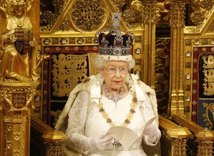 Britain's Queen Elizabeth II reads the Queen's Speech from the throne during the State Opening of Parliament in the House of Lords in London, Wednesday, May, 18, 2016.