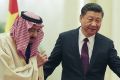 Chinese President Xi Jinping invites Saudi Arabia's King Salman bin Abdulaziz Al Saud to view an honour guard during a ...